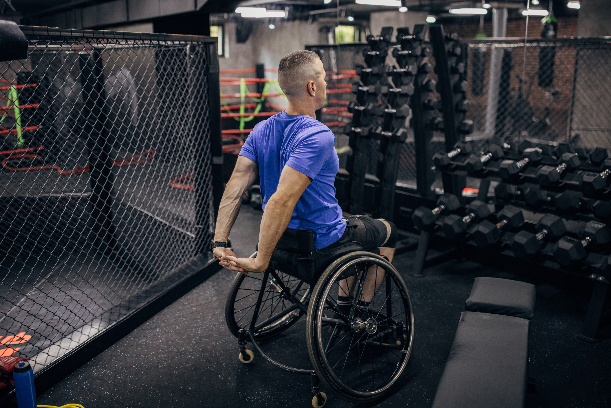 Disabled man training in gym